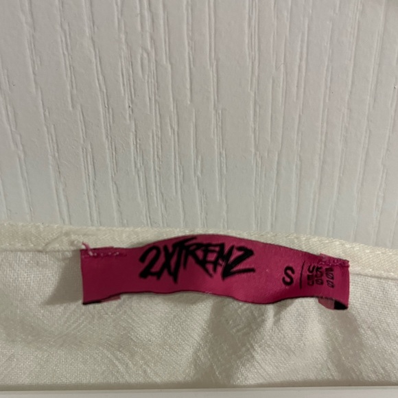 Fitted white button up shirt with tie-able strings on the ends of the sleeves. - Picture 3 of 3